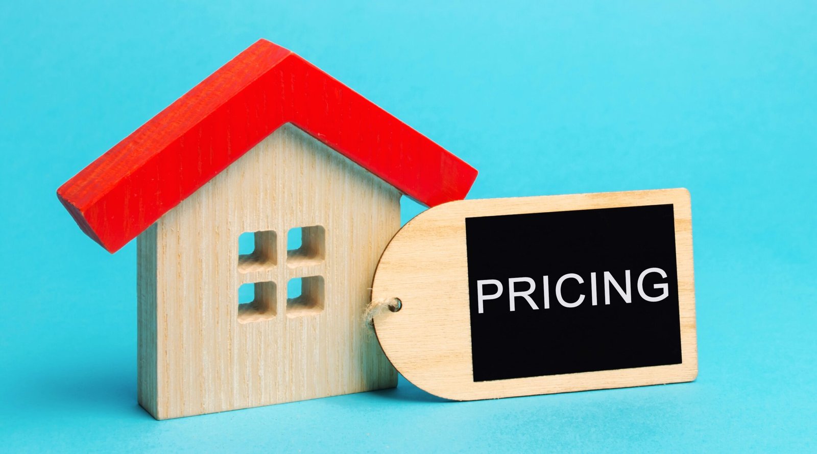 Wooden house with the words Pricing The cost of housing in the primary and secondary market Demand for real estate Apartments and houses - Home Builder Marketers When Should You Use Fixed Price vs Cost Plus When Billing for a New Home Build