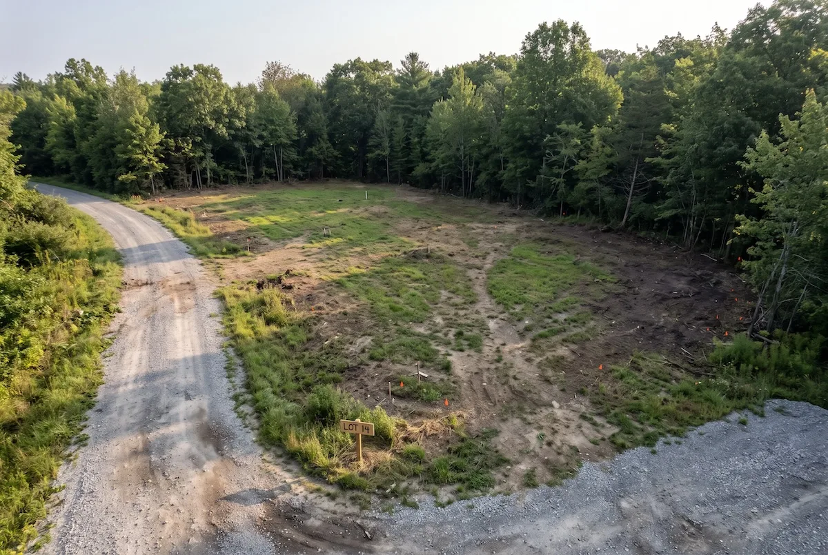 YouTube Ad Examples for Home Builders: 10 Scripts That Get Homeowners to Call 1 an empty buildable lot at the edge of a wooded area